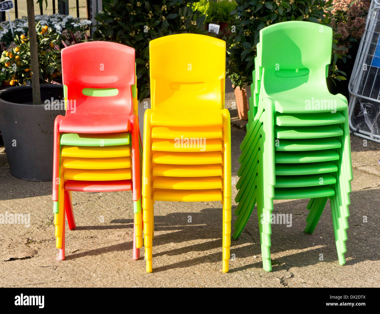 Stacks of colorful plastic children's chairs Stock Photo Alamy