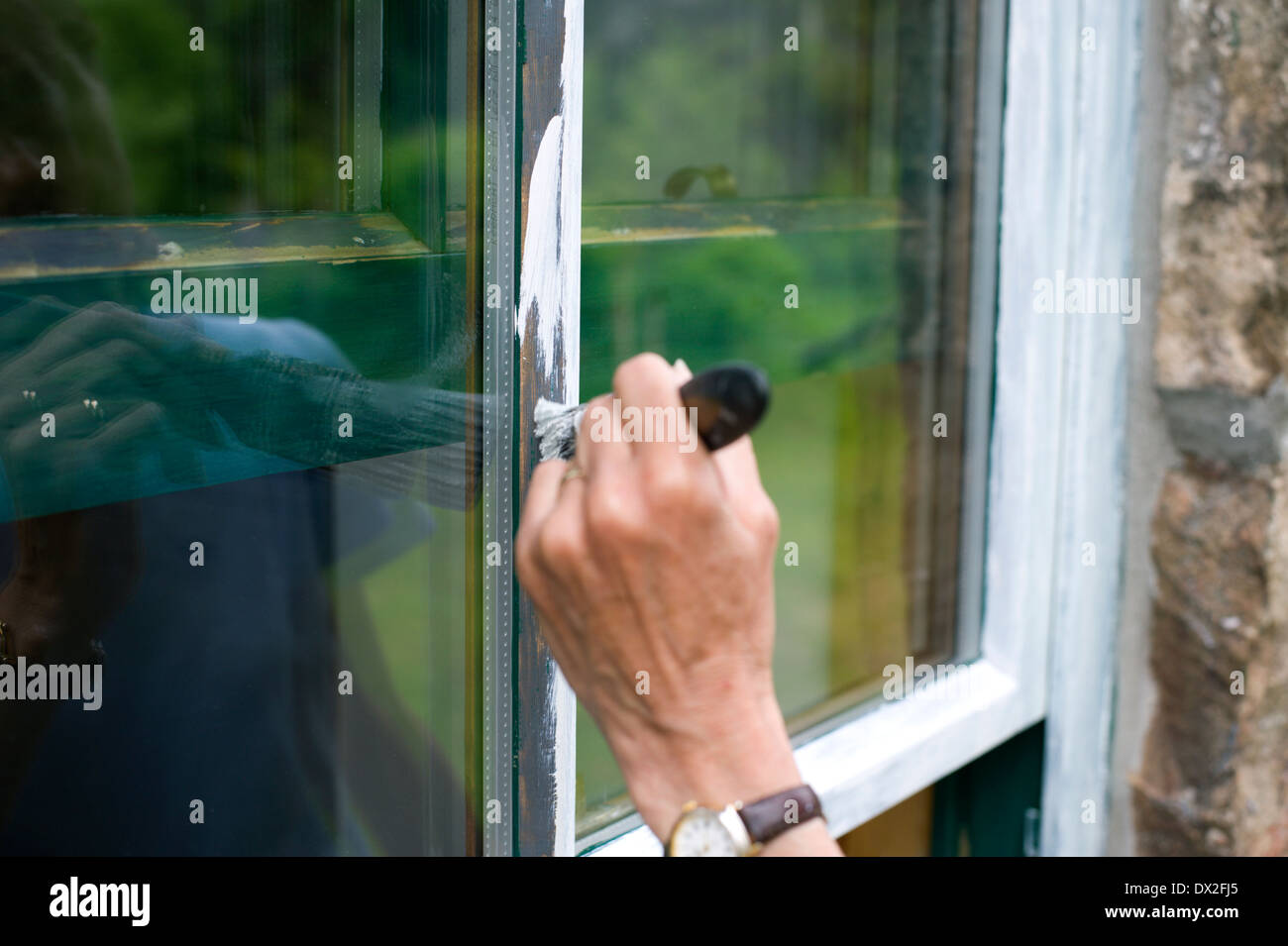Painting exterior sash window Stock Photo Alamy