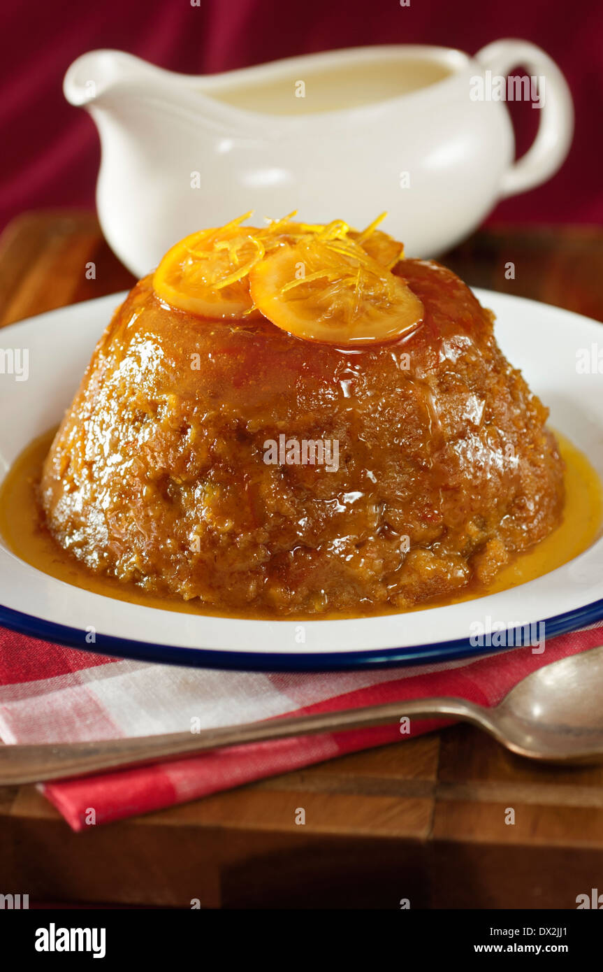 Steamed orange marmalade pudding. Traditional dessert UK Stock Photo