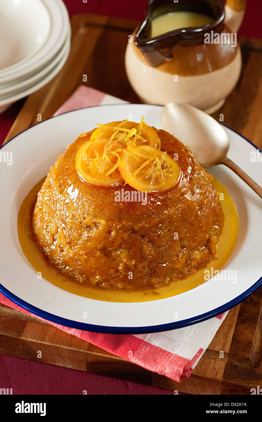 Steamed orange marmalade pudding. Traditional dessert UK Stock Photo
