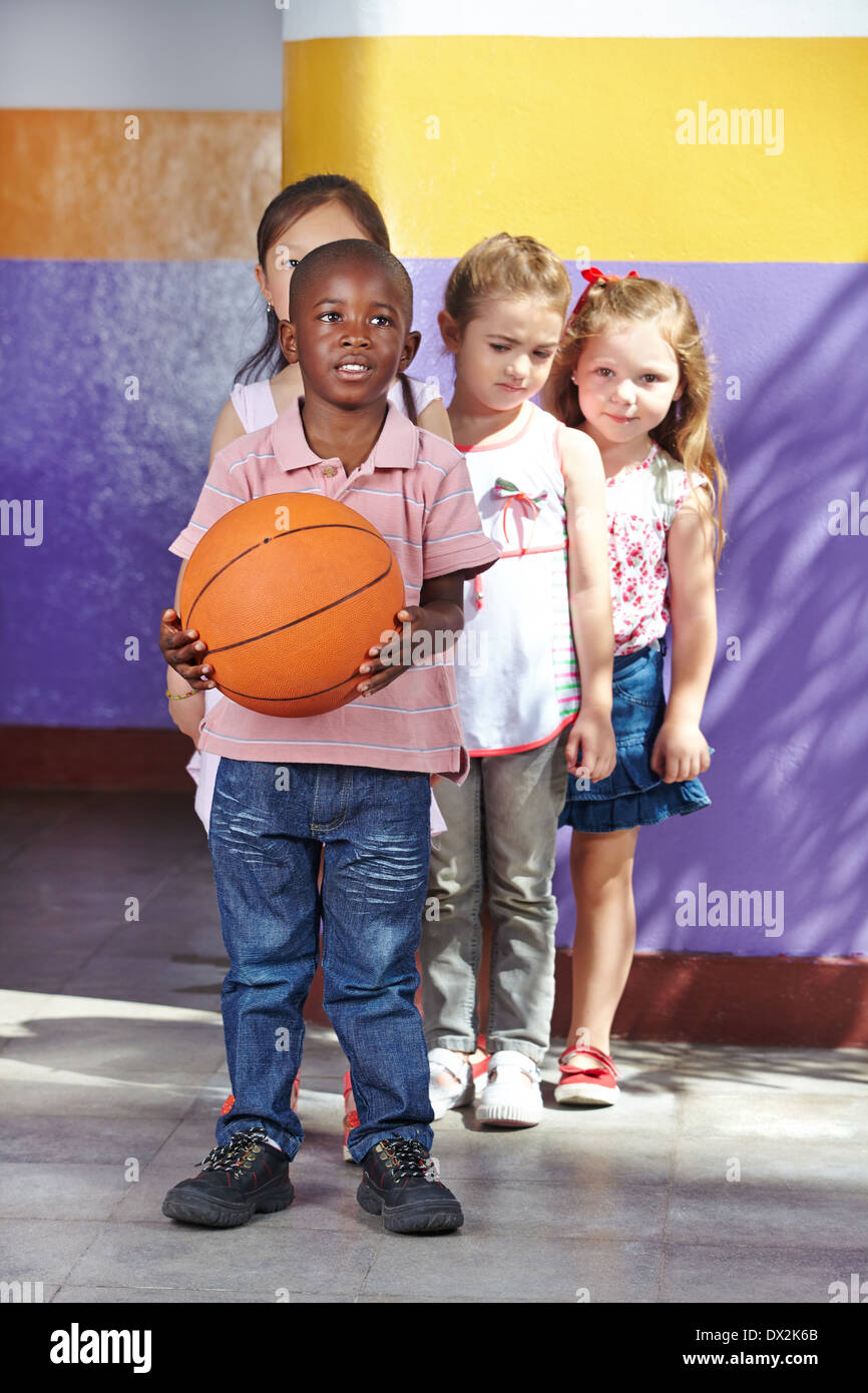 Children playing with basketball in a kindergarten Stock Photo