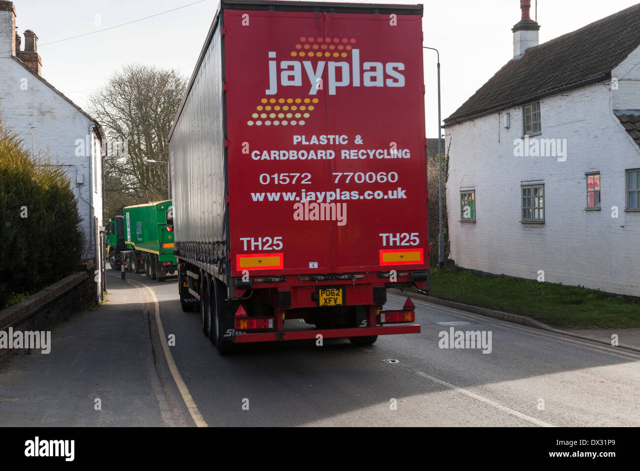 HGV lorry passing close to houses on a road in the village of Rempstone, Nottinghamshire, England, UK Stock Photo