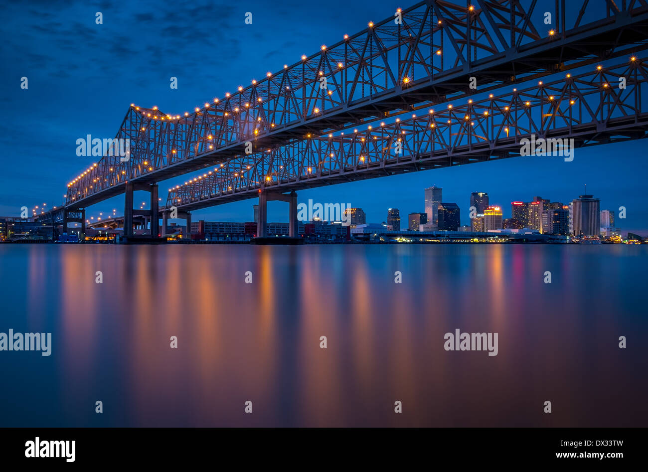 NEW ORLEANS - CIRCA FEBRUARY 2014: Night view of the Crescent City Connection over the Mississippi River and New Orleans Skyline Stock Photo