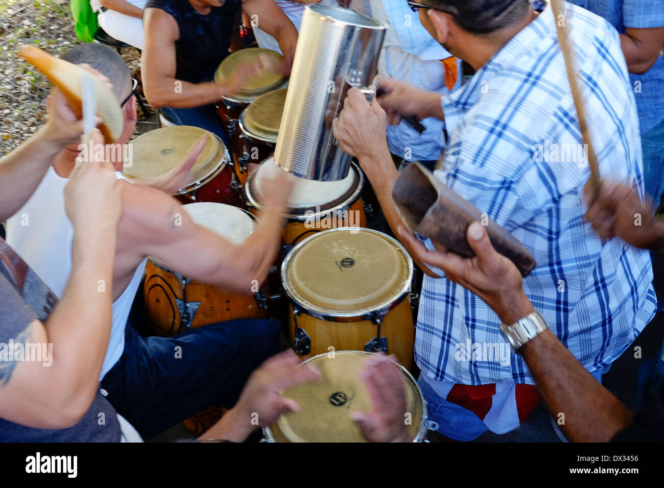 MIAMI - MARCH 9, 2014: Band playing music in the streets of calle 8 during the  37th Calle Ocho festival, an annual event that takes place over Eight Street in Little Havana featuring plenty of music, food, and  it is the biggest party in town that celebrates hispanic heritage. Stock Photo