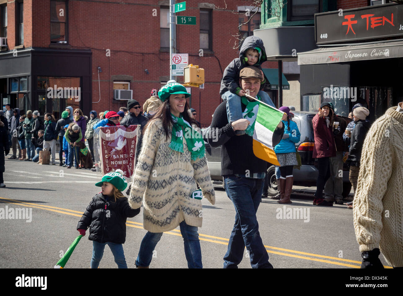 Families celebrate St. Patrick's Day at the IrishAmerican Parade in