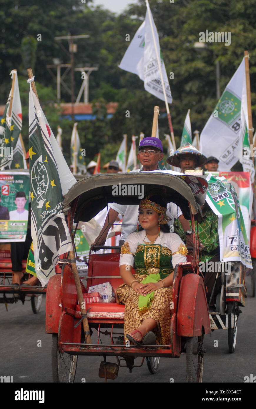 Central Java, Indonesia. 15th Feb, 2013. MARCH 15: Participant from the National Awakening Party (PKB) take part on parade to mark opening of Indonesia election campaign in Indonesia on March 15, 2014 in Solo, Central Java, Indonesia. Indonesian elections will be held on April 9, 2014 while voting to Indonesia President election held July 9, 2014. Indonesia election followed by 12 parties with 180 million voters to take the part. © Sijori Images/ZUMAPRESS.com/Alamy Live News Stock Photo