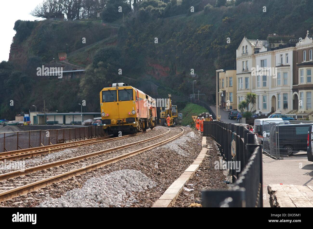 Dawlish, UK. 17th March, 2014. A work train at Dawlish in Devon where repairs to the storm-damaged mainline railway are due to be completed by April 4 Credit:  Rob Cousins/Alamy Live News Stock Photo