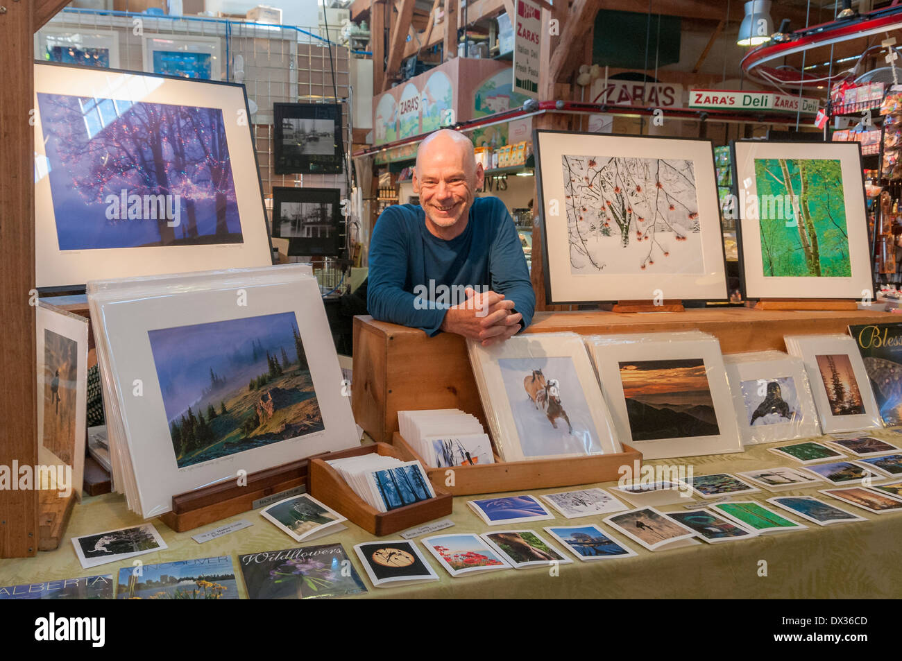 Photographer Michael Wheatley at his booth at Granville Island Public Market, Vancouver, British Columbia, Canada Stock Photo