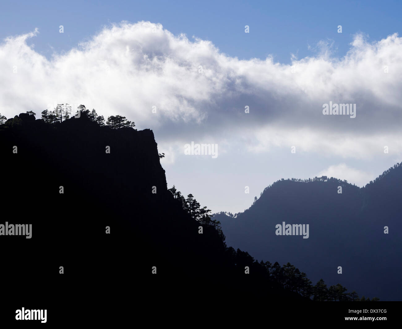 Clouds float above the mountains of the Caldera de Taburiente. Stock Photo