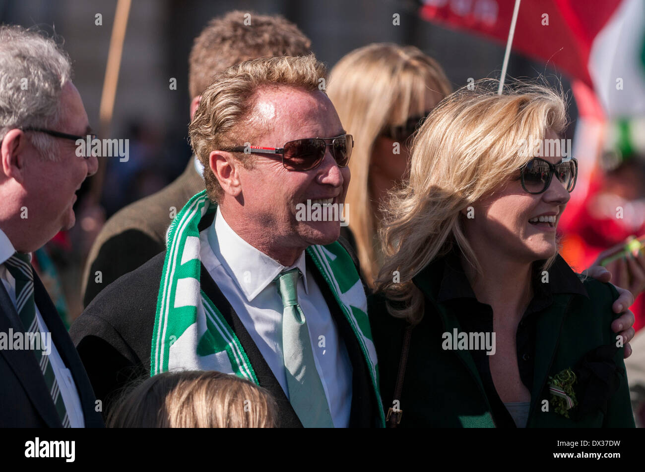 Waterloo Place, London, UK, 16 March 2014 - the annual St. Patrick's Day parade took place in bright sunshine in front of thousands of people who lined the route.  Michael Flatley and his wife, along with Irish dignitaries, were at the head of the parade. Credit:  Stephen Chung/Alamy Live News Stock Photo