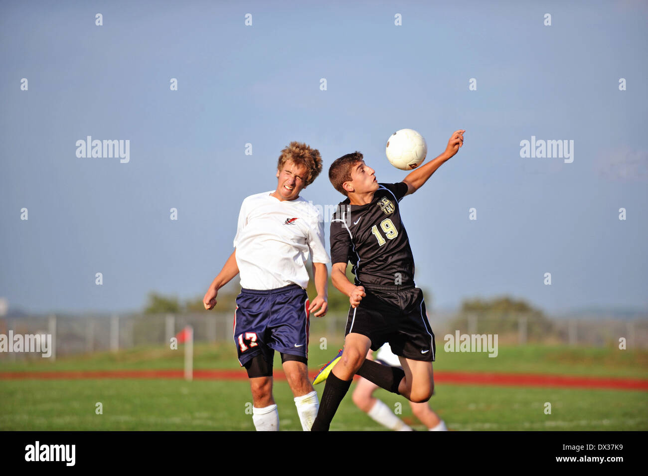 Two players rebound from a header collision. USA Stock Photo