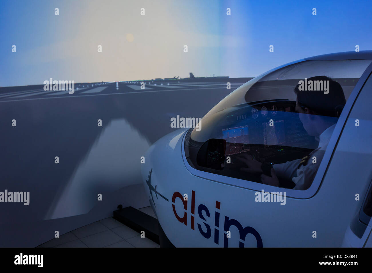 Student navigating virtual airplane in flight simulator at the VLOC / Flemish aviation training center in Ostend, Belgium Stock Photo
