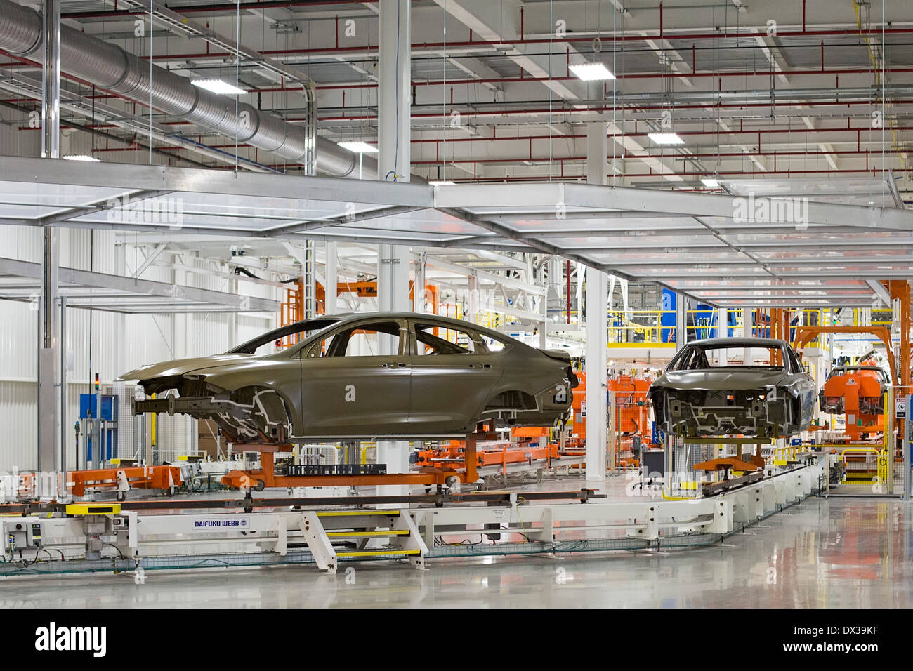Car bodies move along a conveyor in the paint shop at Chrysler's Sterling Heights Assembly Plant. Stock Photo