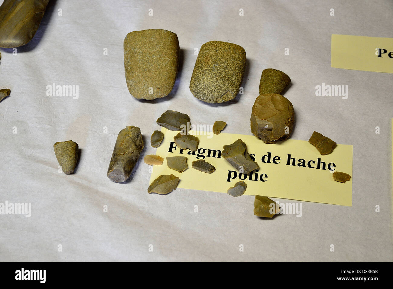Fragments of polished ax, neolithic (Couesmes-Vaucé, North Mayenne, Loire country, France). Stock Photo