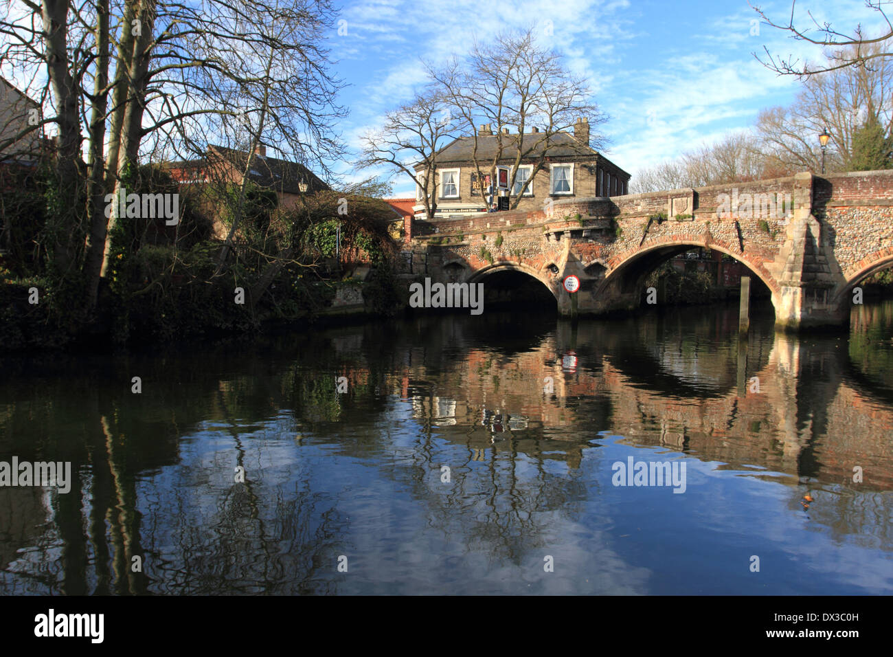 bridge over wensum river, the red lion pub at background