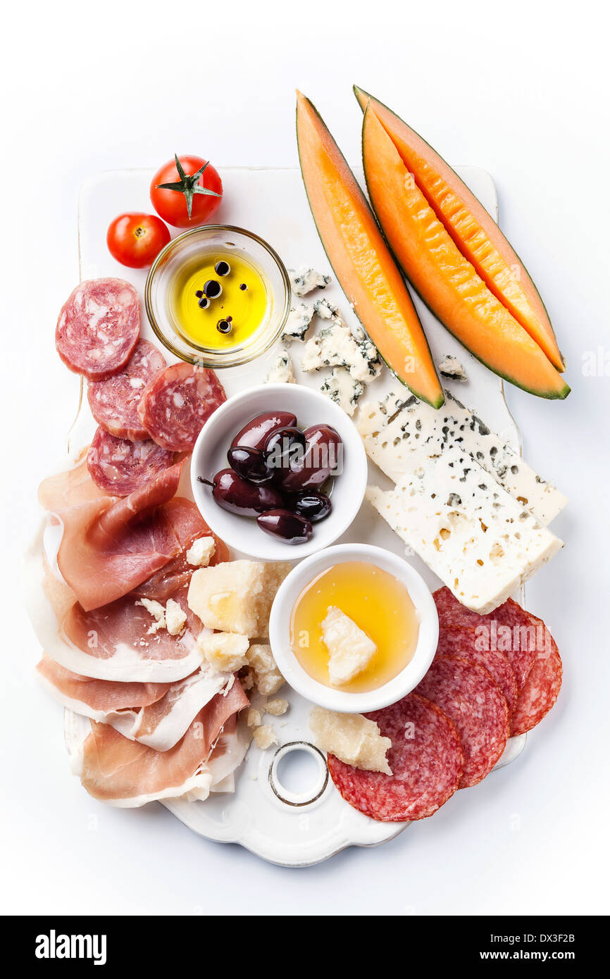 Antipasti ham, cheese, melon, olive oil with balsamic Stock Photo Alamy