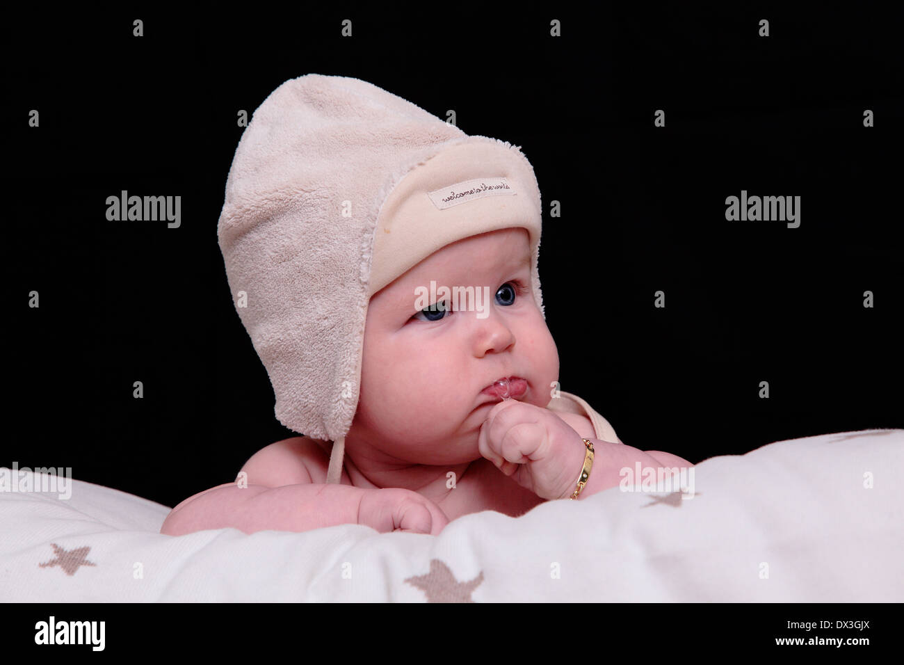 Thoughtful baby blowing bubbles Stock Photo Alamy