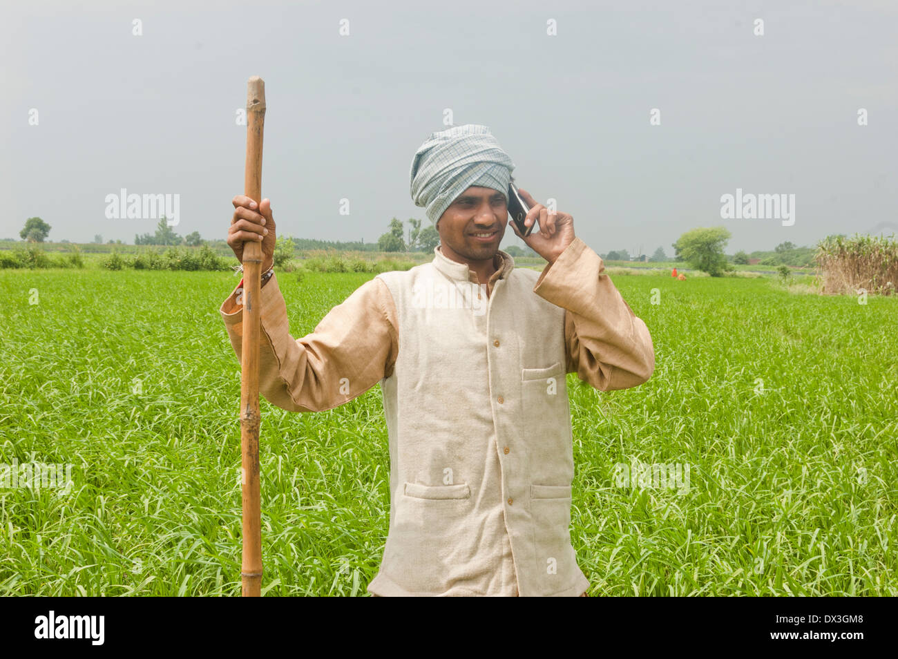 1 Indian Farmer Standing in Field and Talking with mobile Stock Photo ...