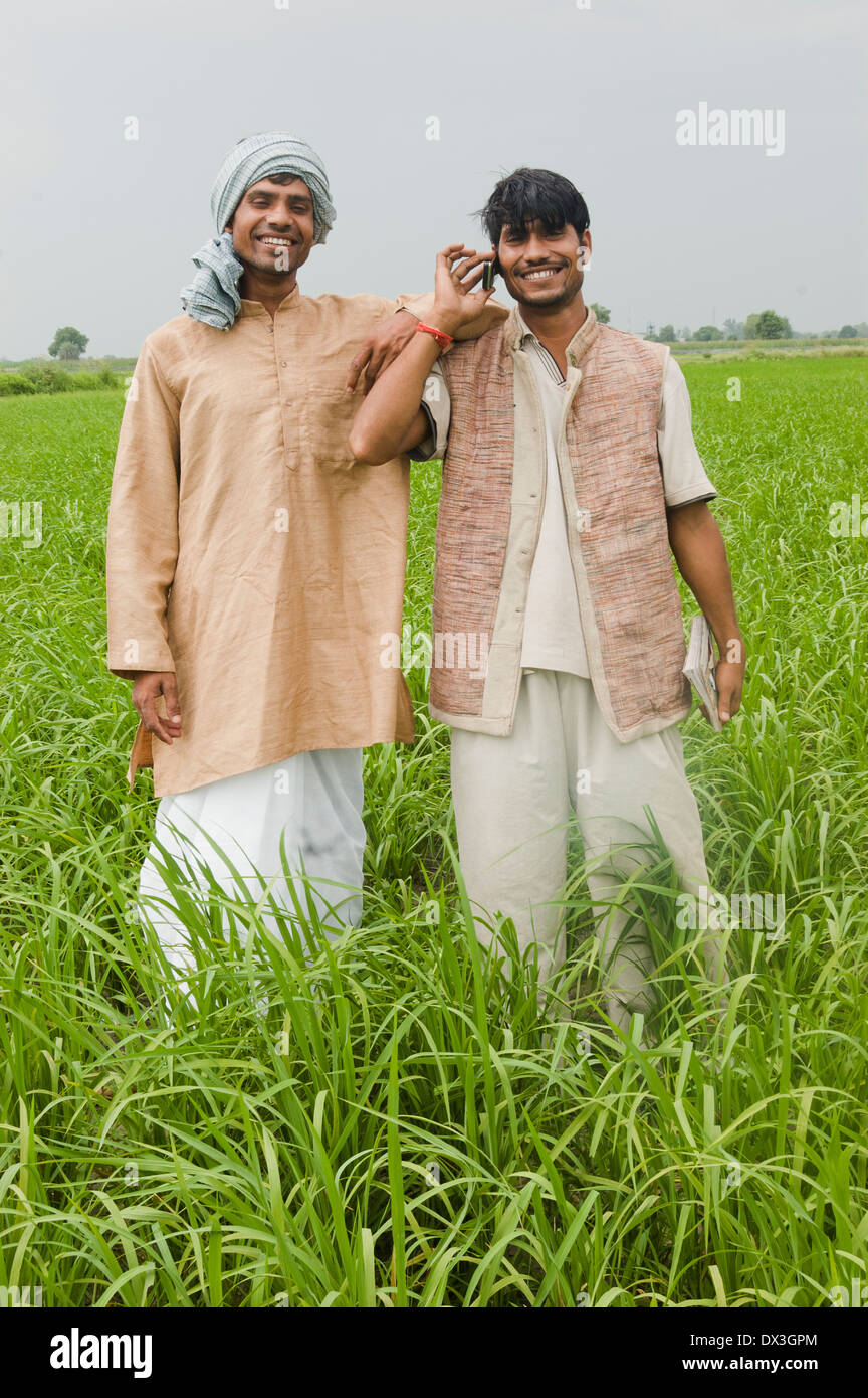 Indian Farmer standing and talking with mobile Stock Photo - Alamy