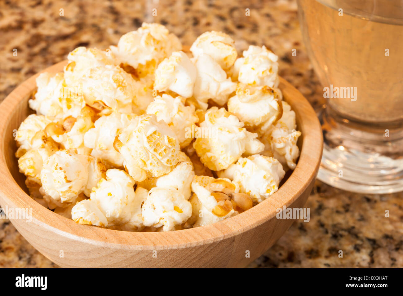 Wooden dish of kettle corn popcorn with a sugary glaze Stock Photo