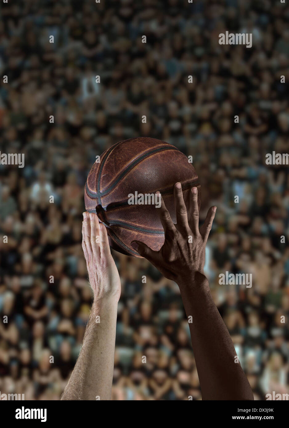 White Caucasian and Black African American Hands & Arms During Tip Off In Basketball Game Stock Photo