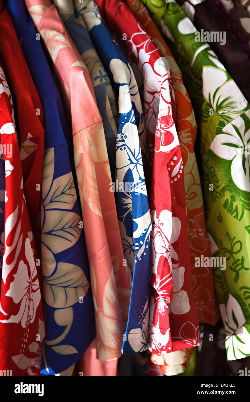 Multicolor Hawaiian shirts hanging in a row, close up, full frame Stock Photo