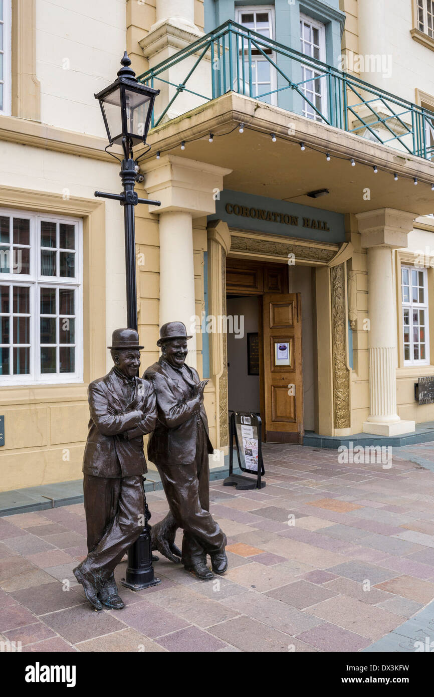 Statue of Stan Laurel and Oliver Hardy outside the Coronation Hall Theatre, Ulverston, Cumbria. Stock Photo