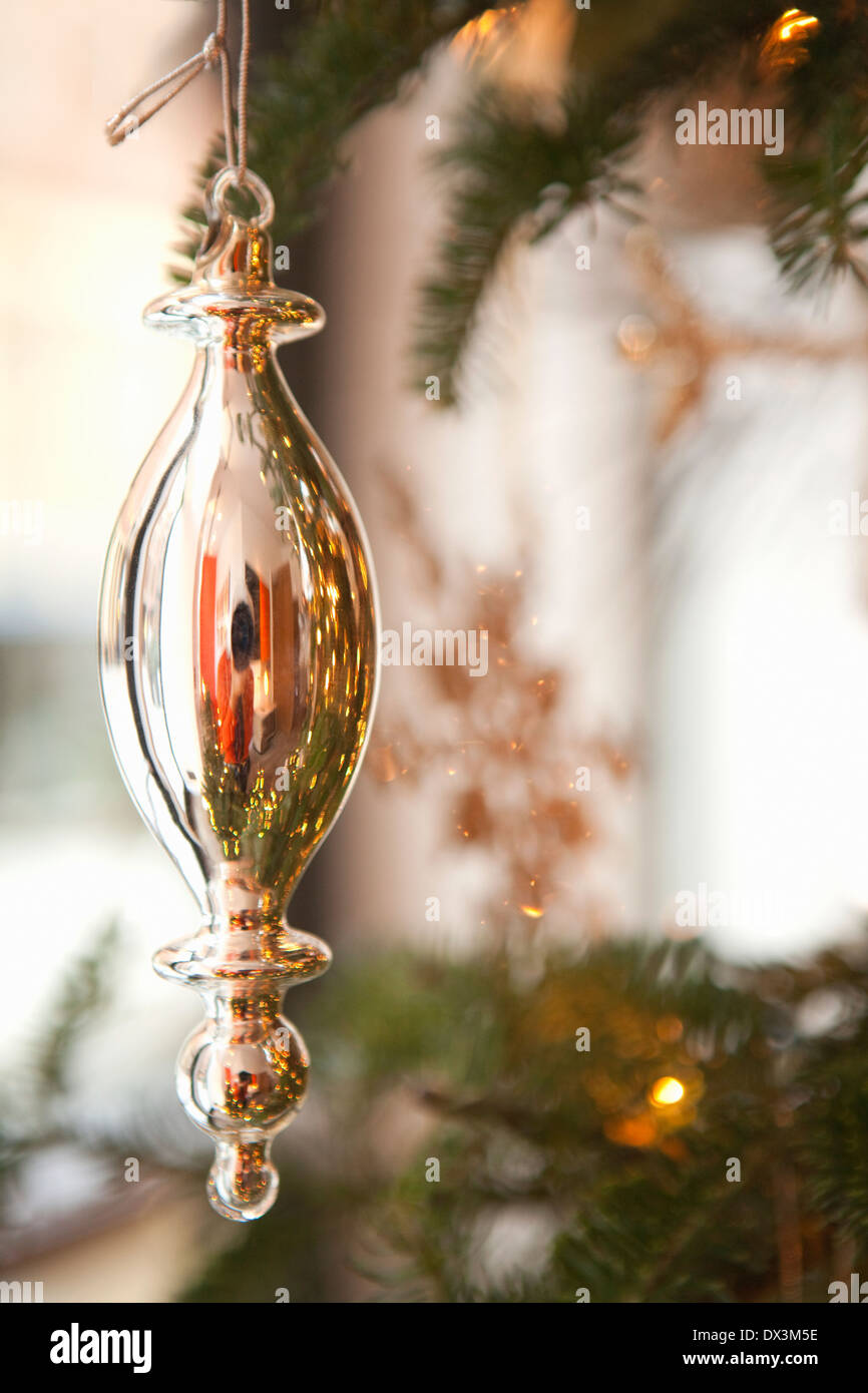 Silver ornament hanging on Christmas tree, close up Stock Photo