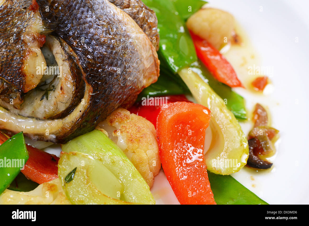 The sea bass fillet with spring vegetables Stock Photo Alamy