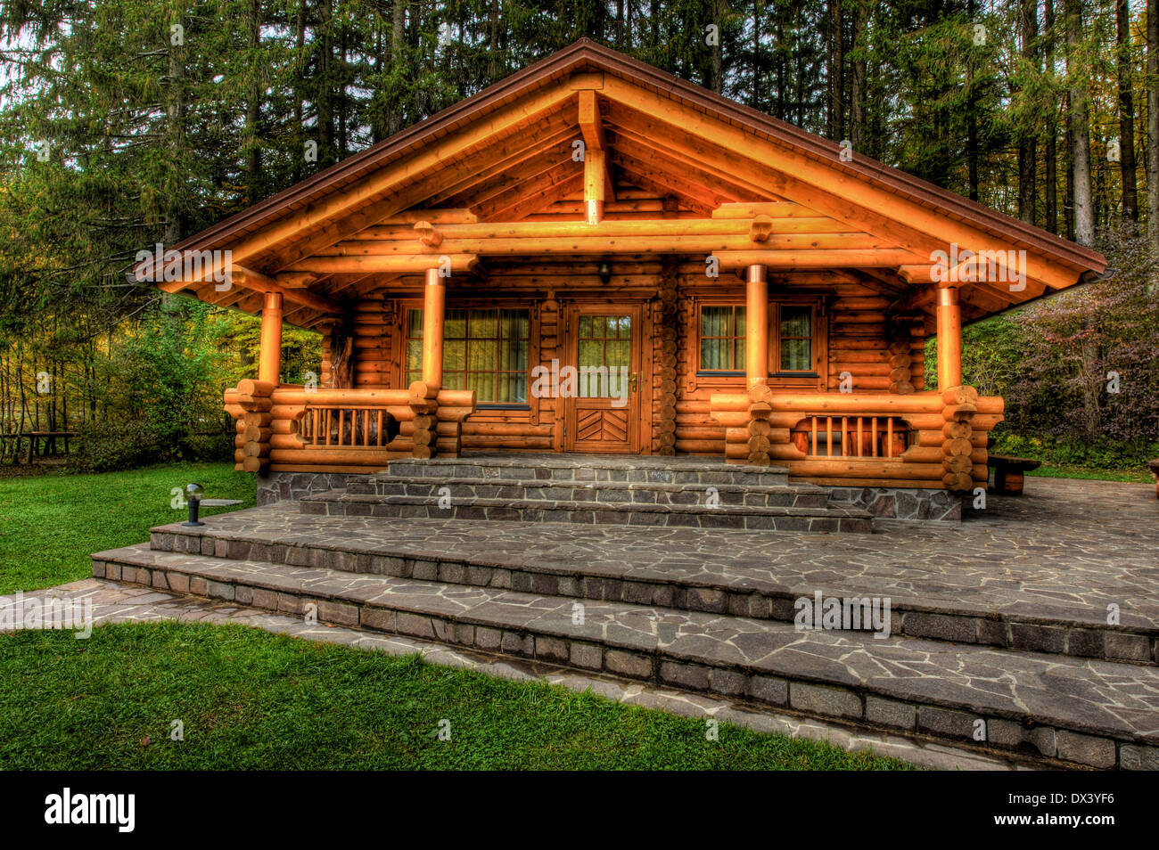 Holiday apartment - wooden cottage in forest Stock Photo - Alamy