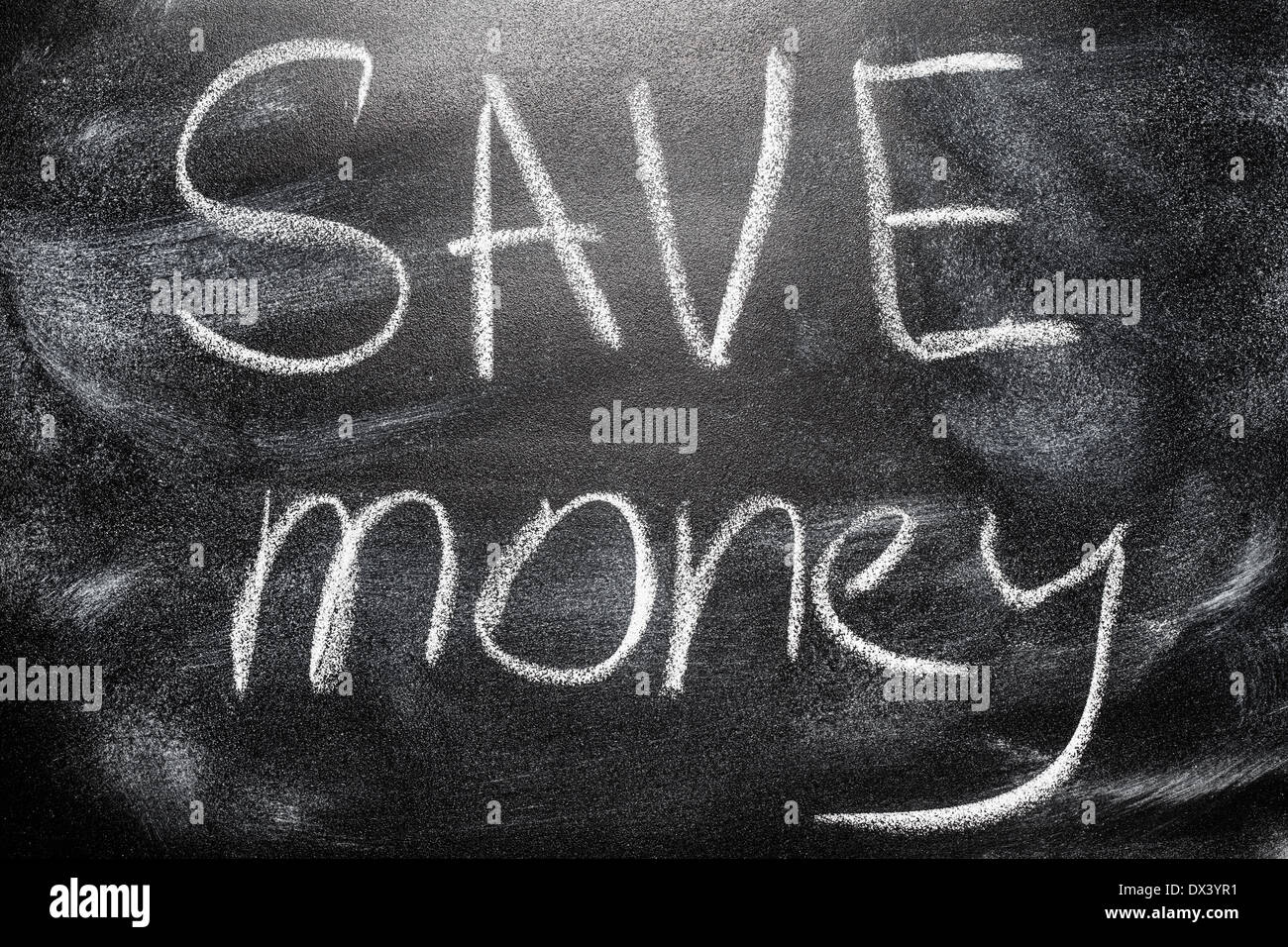 Handwritten message on a school chalkboard writing concept inscription, communication message Save Money Stock Photo