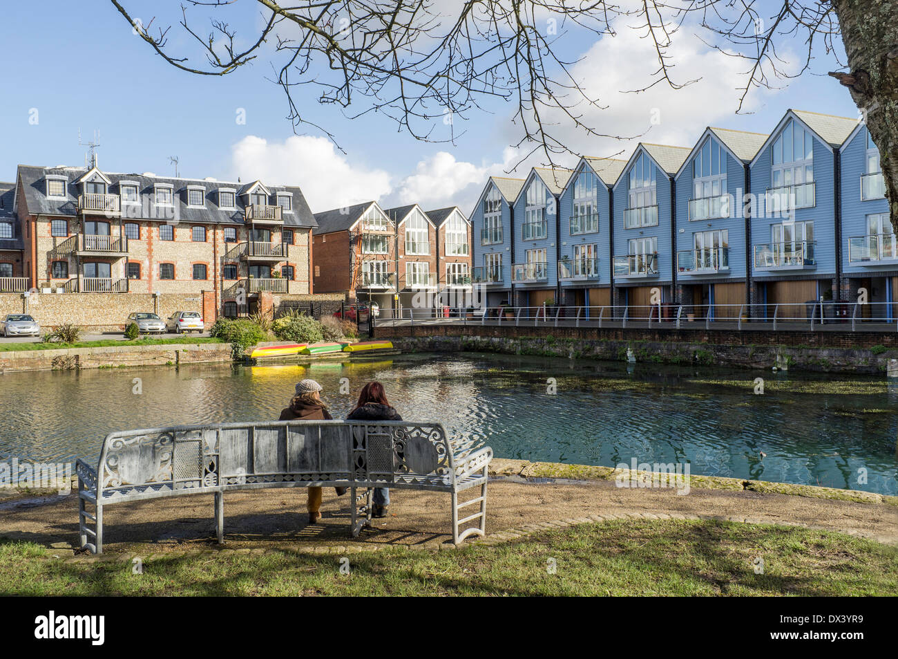 Chichester canal Chichester West Sussex England UK with a seat designed