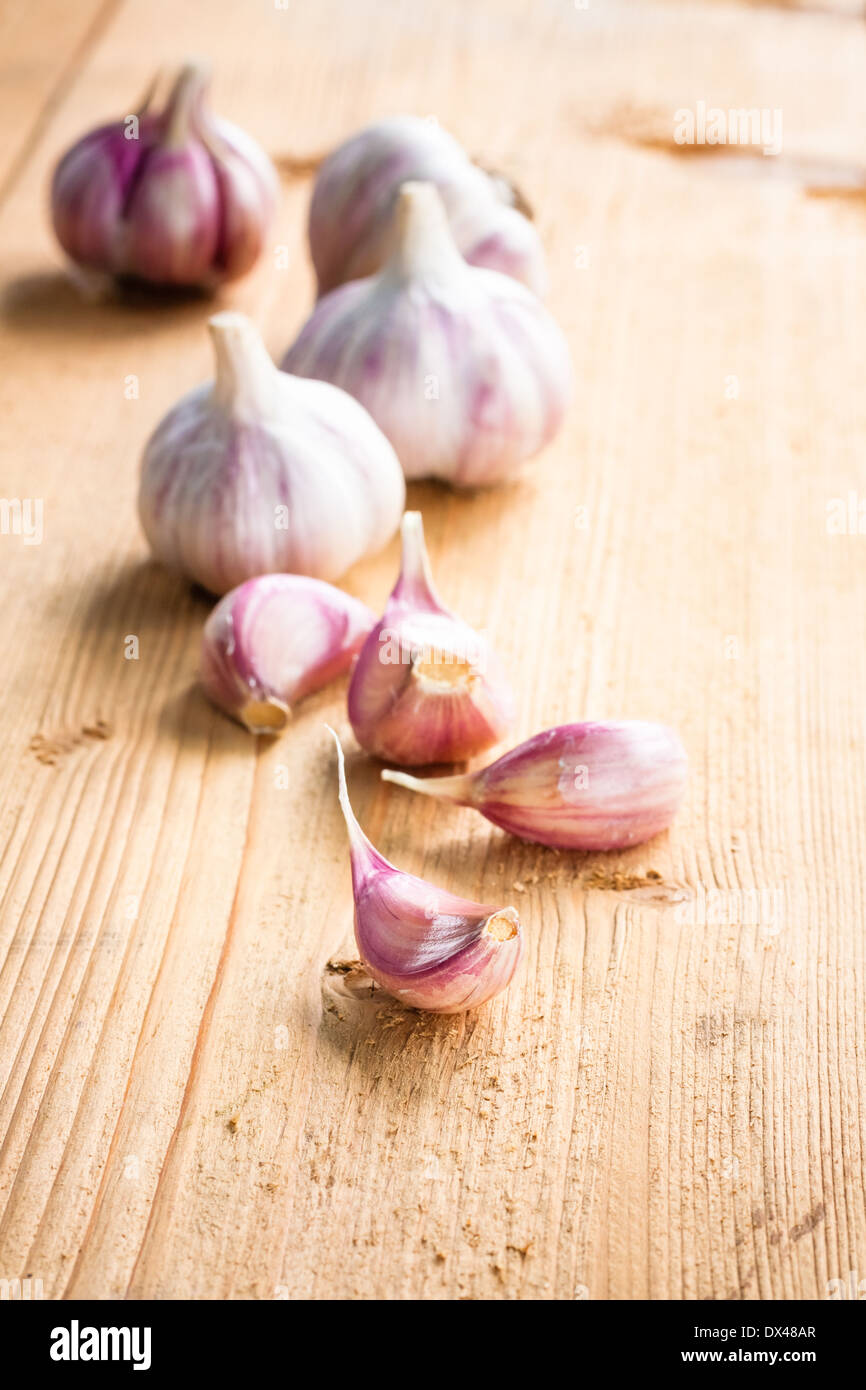 Healthy organic garlic vegetables whole and cloves on the wooden ...