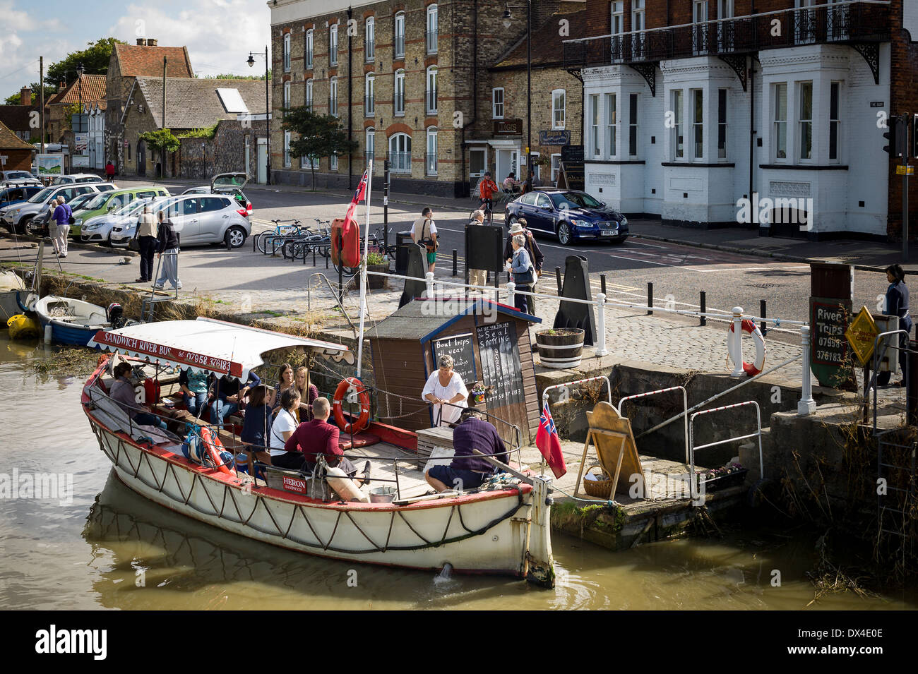 River boat with tourists at quayside on River Stour in Sandwich KENT UK Stock Photo