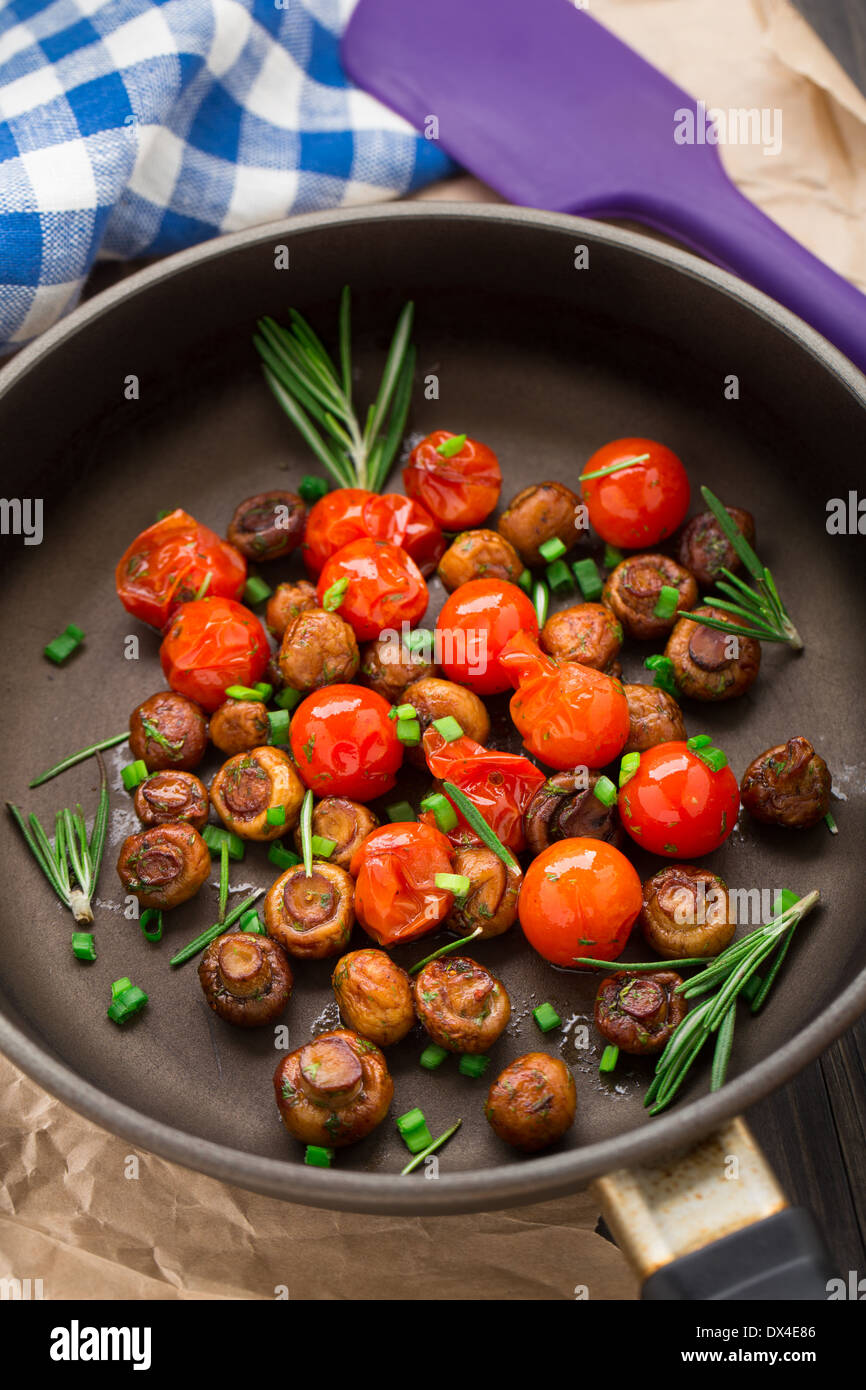 Roasted mushrooms with cherry tomatoes Stock Photo