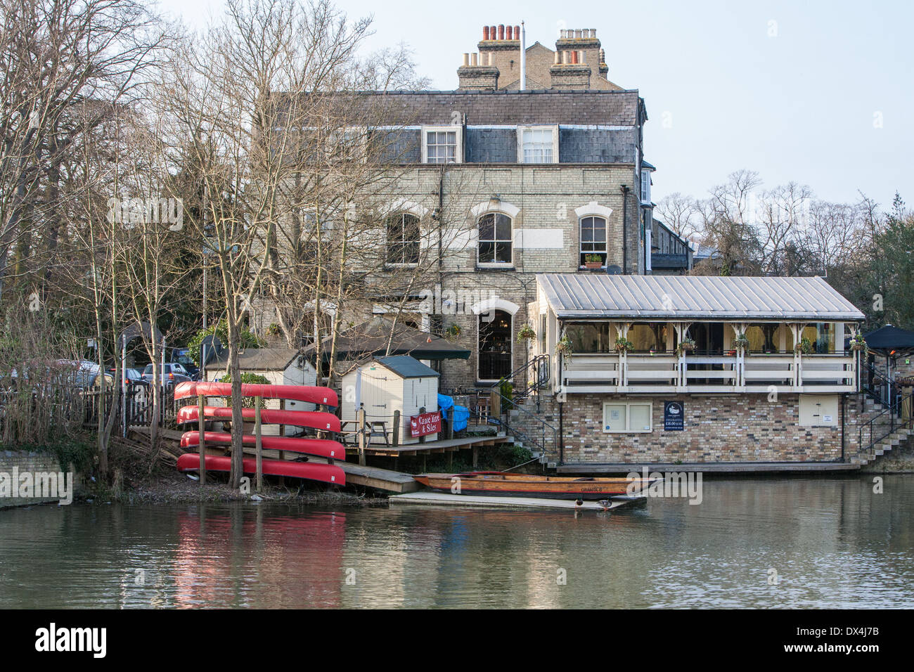 punts and canoes lined up on the River Cam,outside the Granta pub, Newnham Village, Cambridge England Stock Photo