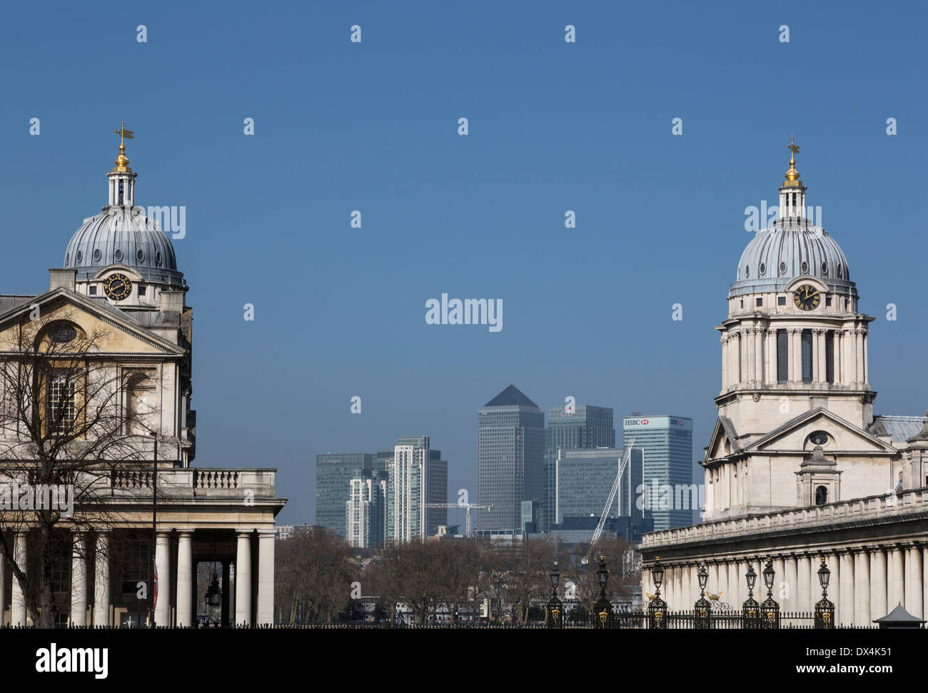 The towers of The Royal Naval College, with the skyline of Canary Wharf in the background. Stock Photo