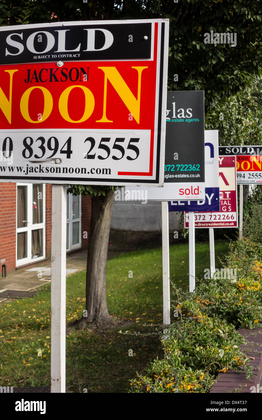 Various Estate Agent Boards displayed outside of flats, Epsom, Surrey