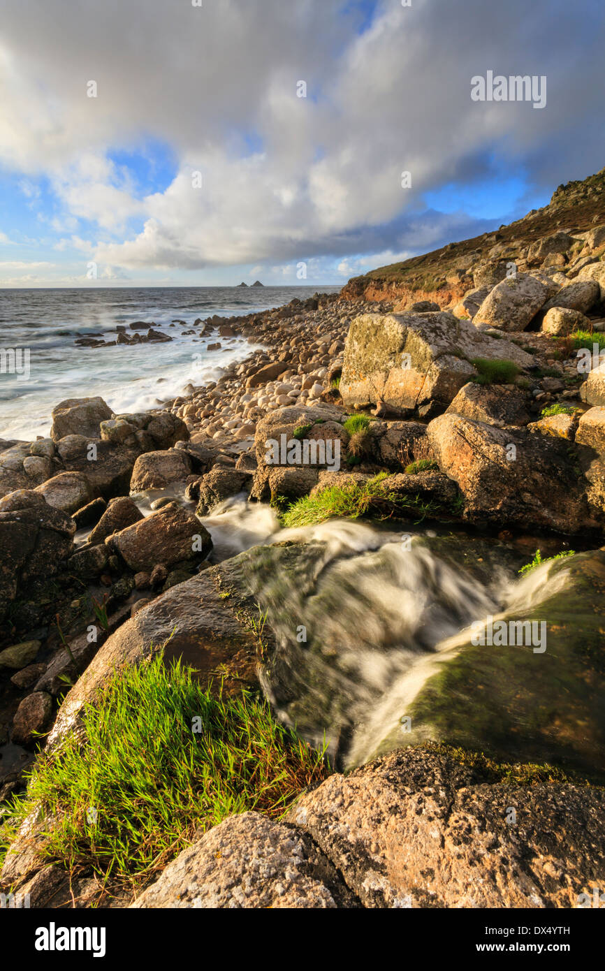 A waterfall at Nanquidno Cove in Cornwall Stock Photo