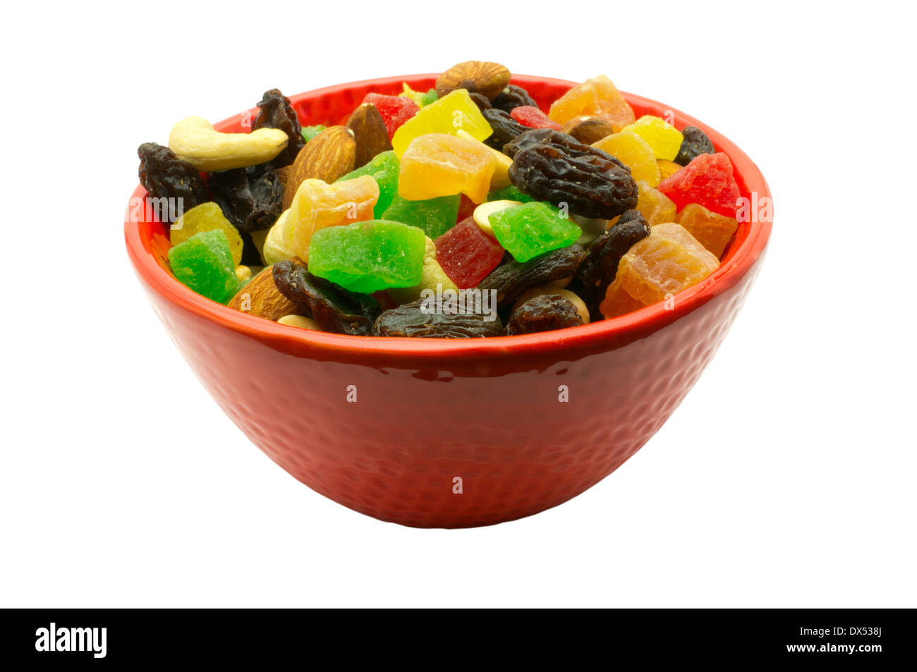 Mixture of dried fruits and nuts in a red cup Stock Photo