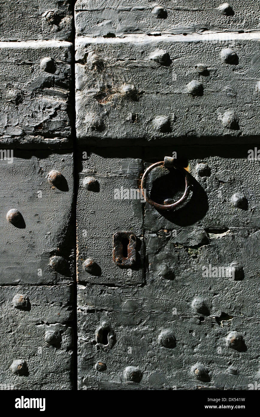 A gray reinforced door with lock and handle Stock Photo - Alamy