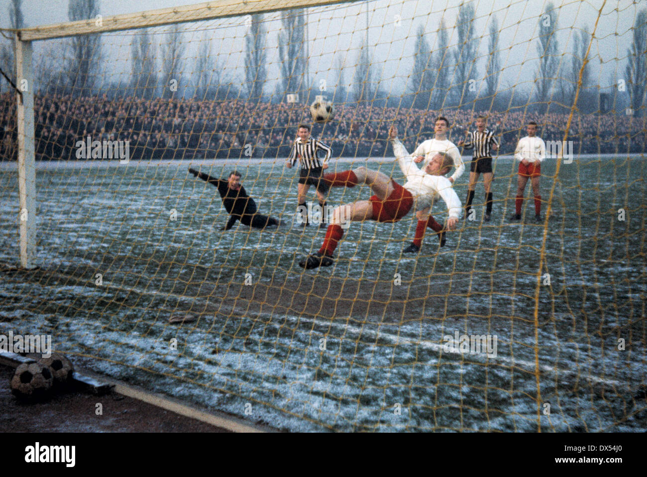 football, Regionalliga West, 1963/1964, Jahn Stadium, VfB Bottrop versus Rot Weiss Essen 1:1, overhead kick by Werner Kik (RWE) on the goalline, left keeper Bernd Brodbek (RWE) Stock Photo