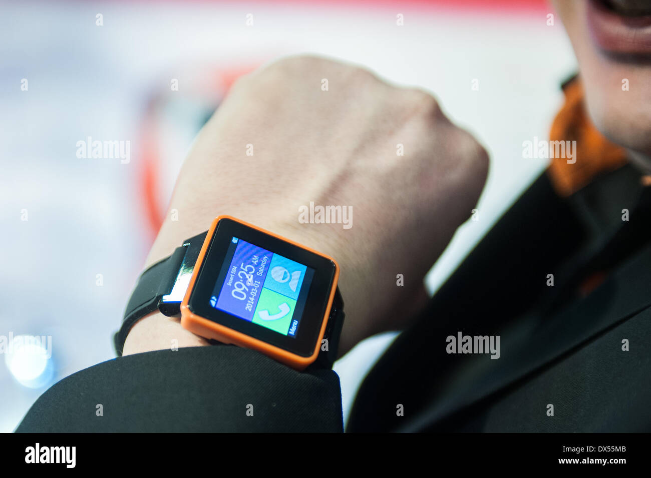London, UK. 18 March 2014. A man wears a Burg smart watch at the Wearable Technology Conference at Olympia in London Credit:  Piero Cruciatti/Alamy Live News Stock Photo