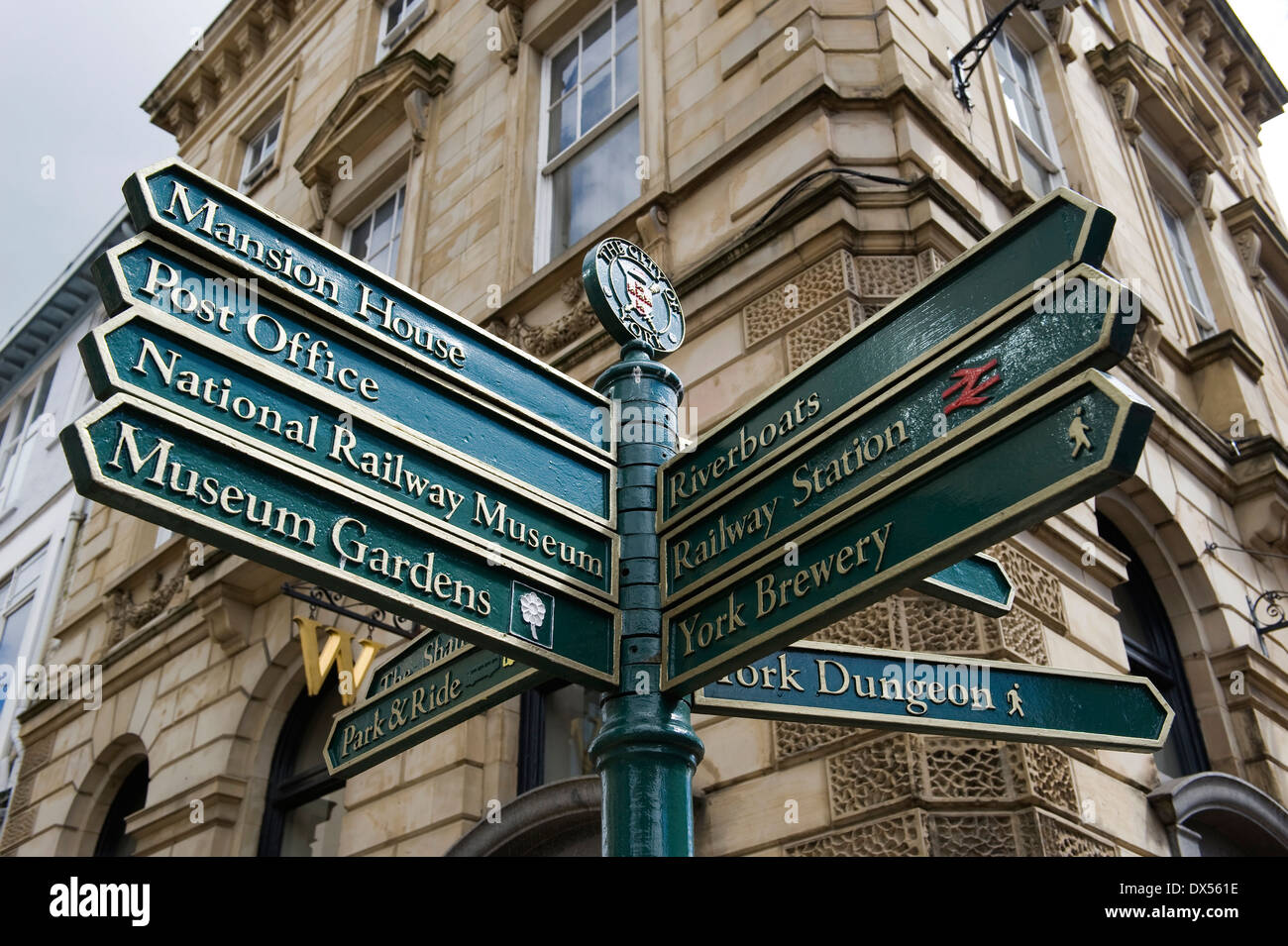 Street sign in York city centre, UK, giving directions to York Dungeon, Mansion House, Riverboats, Railway Station, York Brewery Stock Photo