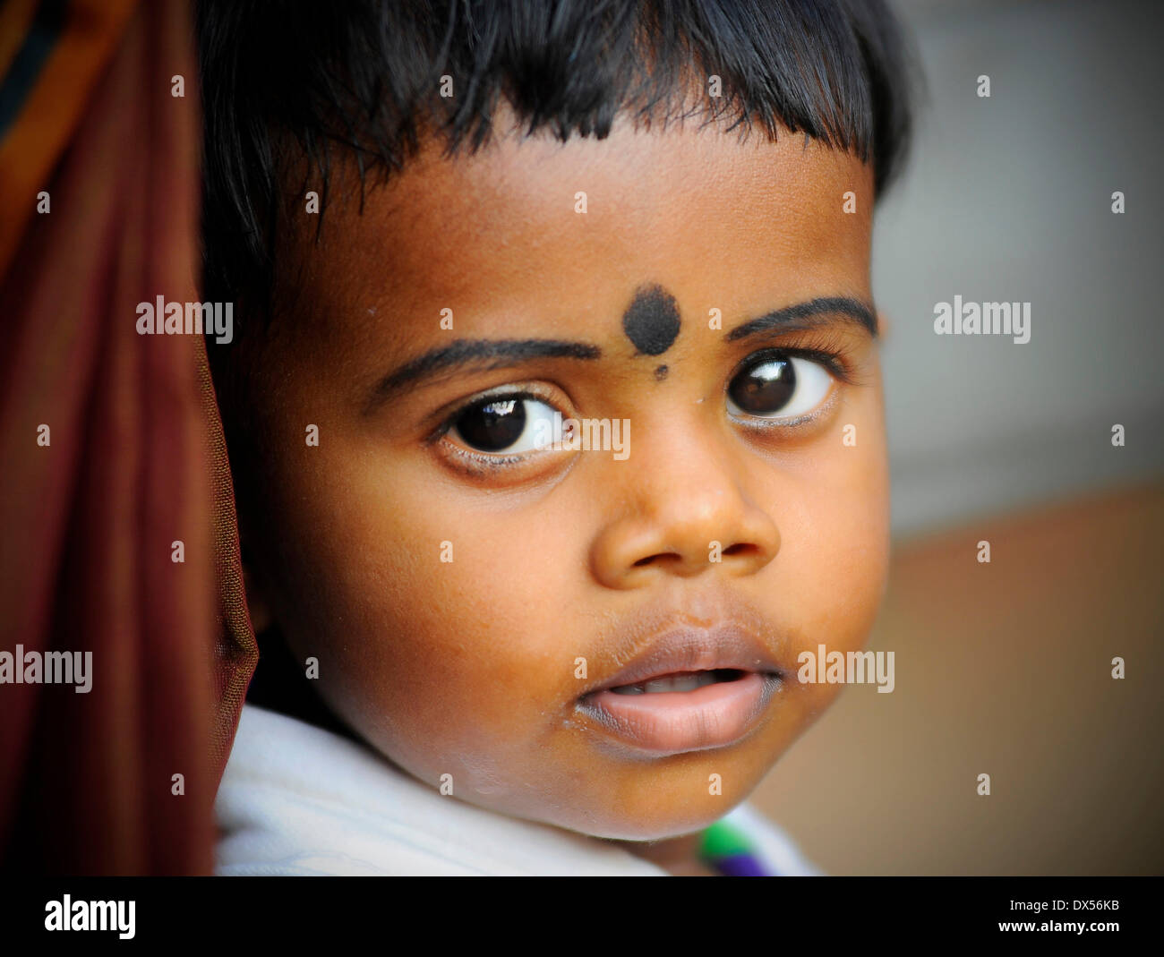 Child at a Hindu temple festival, Thrissur, Kerala, South India, India Stock Photo