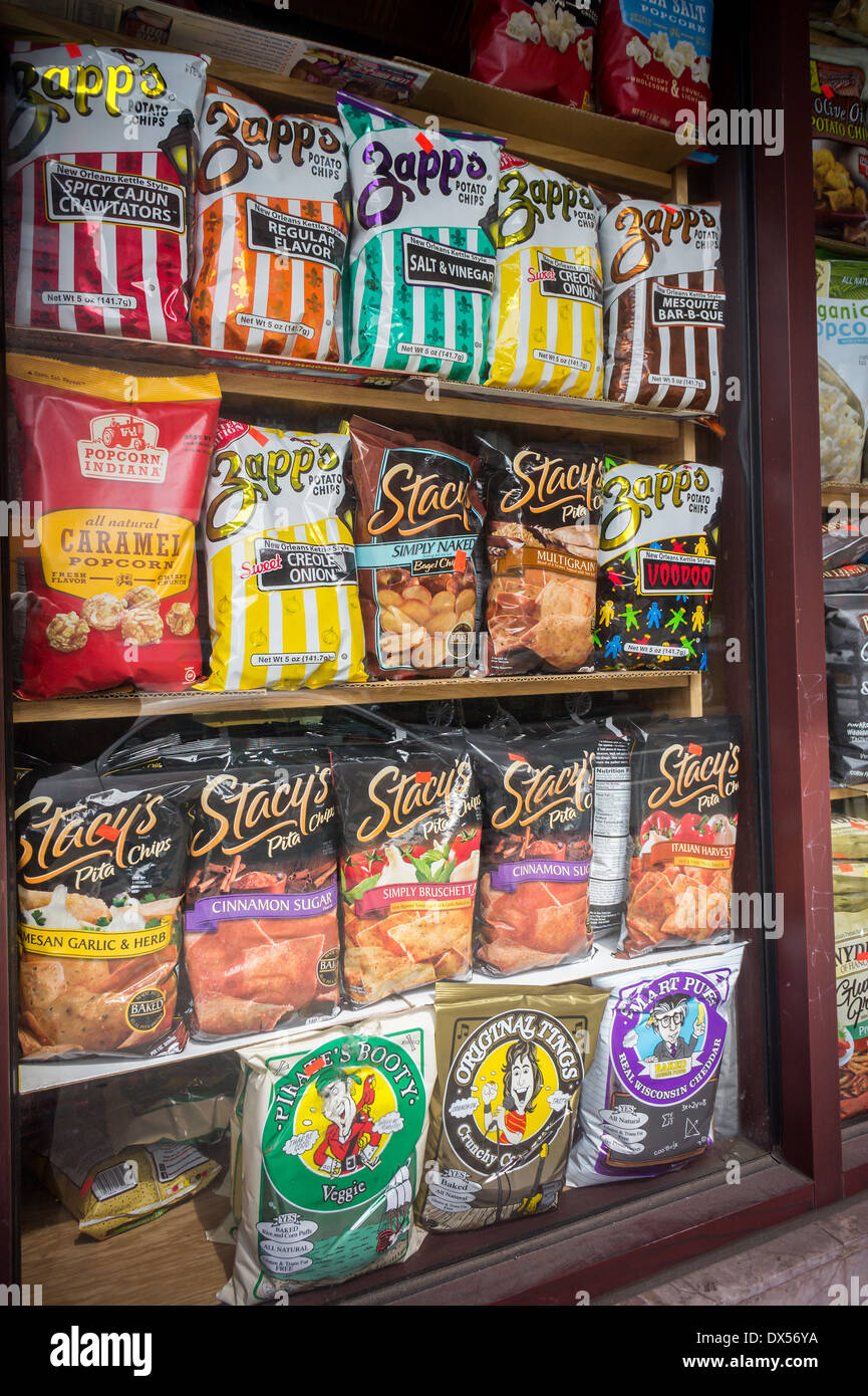 A display of tasty snacks are seen in the window of a grocery store in New York on Sunday, March 16, 2014. (© Richard B. Levine) Stock Photo