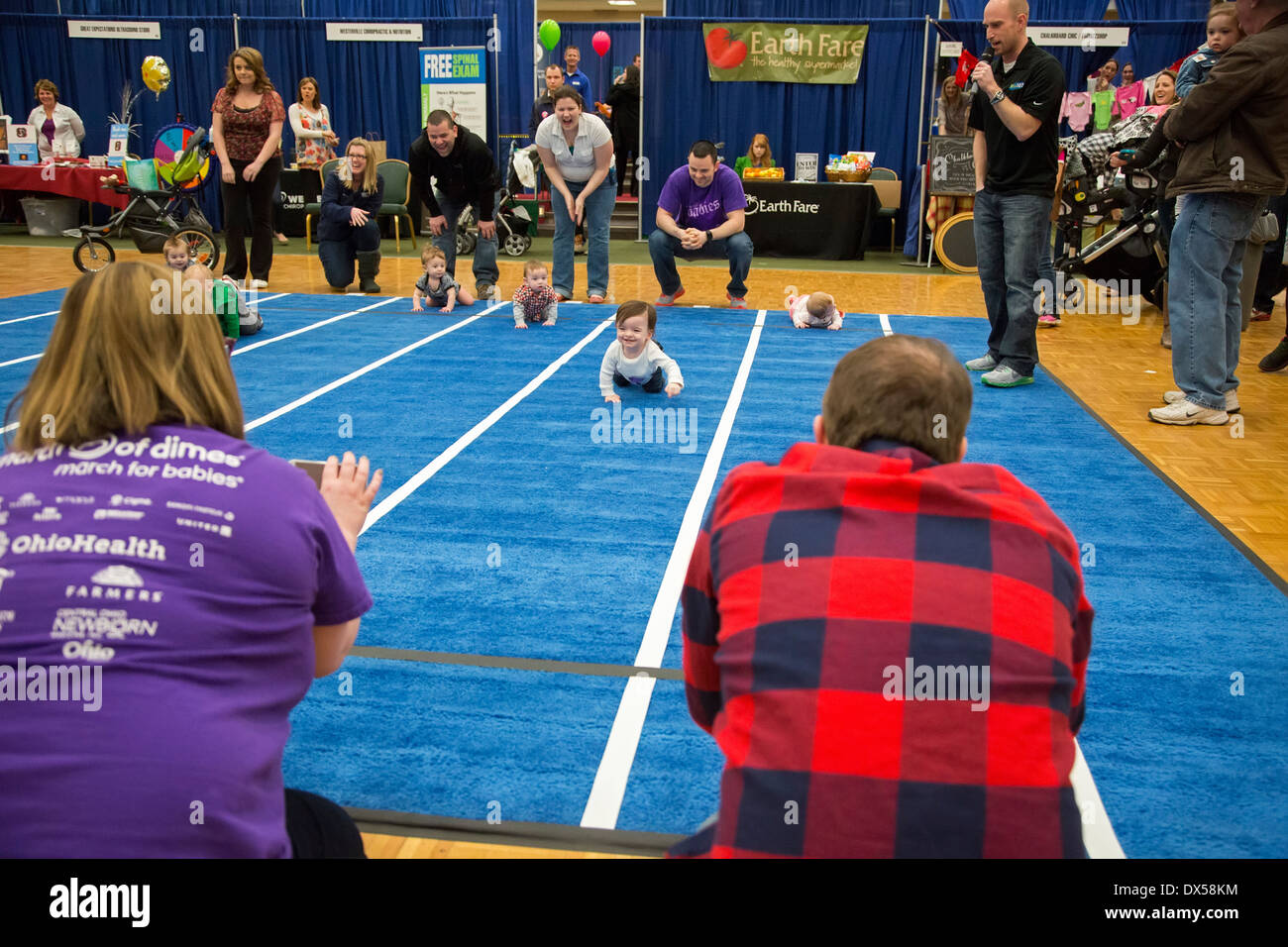 Babies compete in a Diaper Derby race Stock Photo