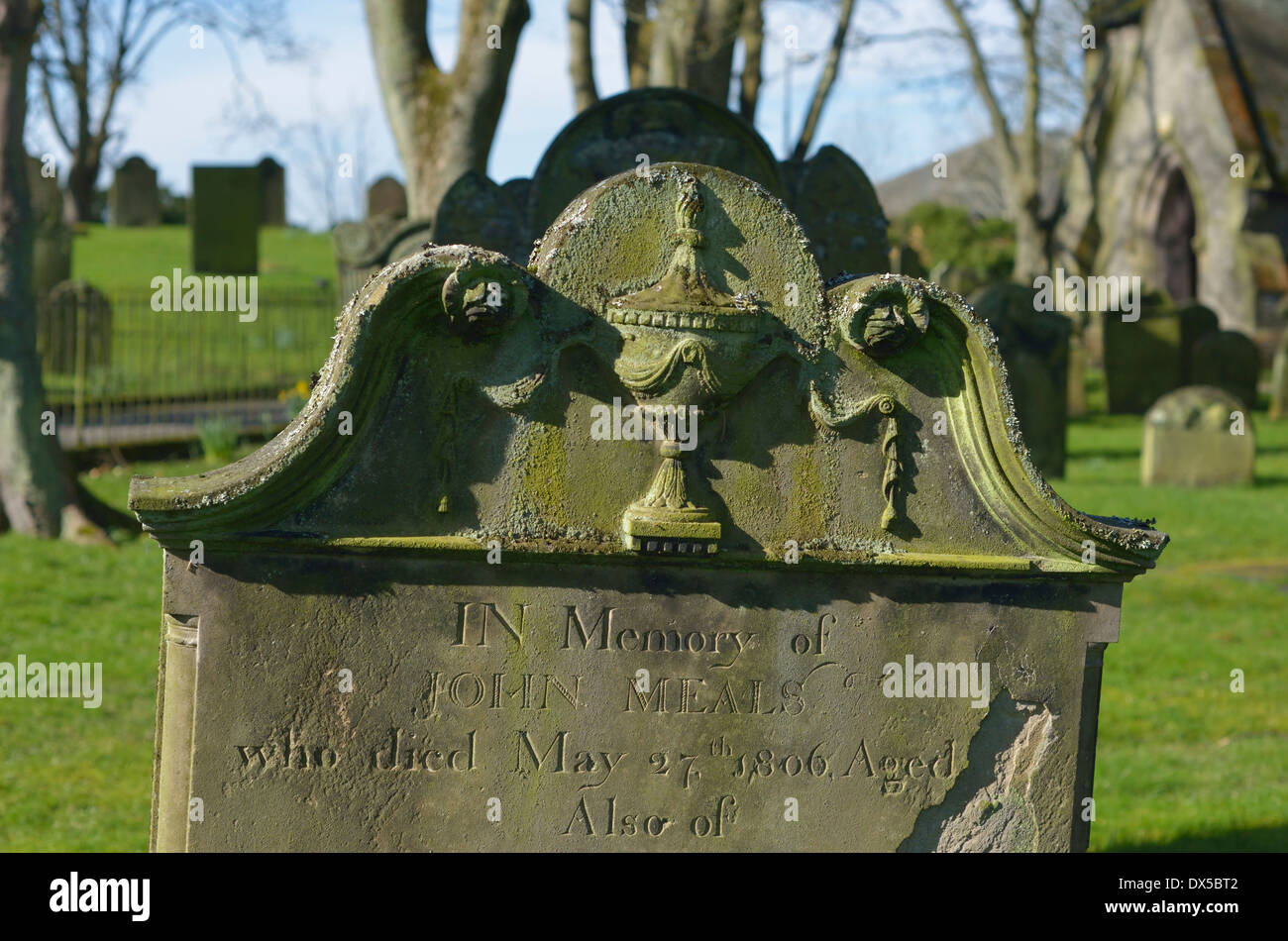 19th.Century gravestone with urn design. All Saints Church, Kirkgate, Cockermouth, Cumbria, England, United Kingdom, Europe. Stock Photo