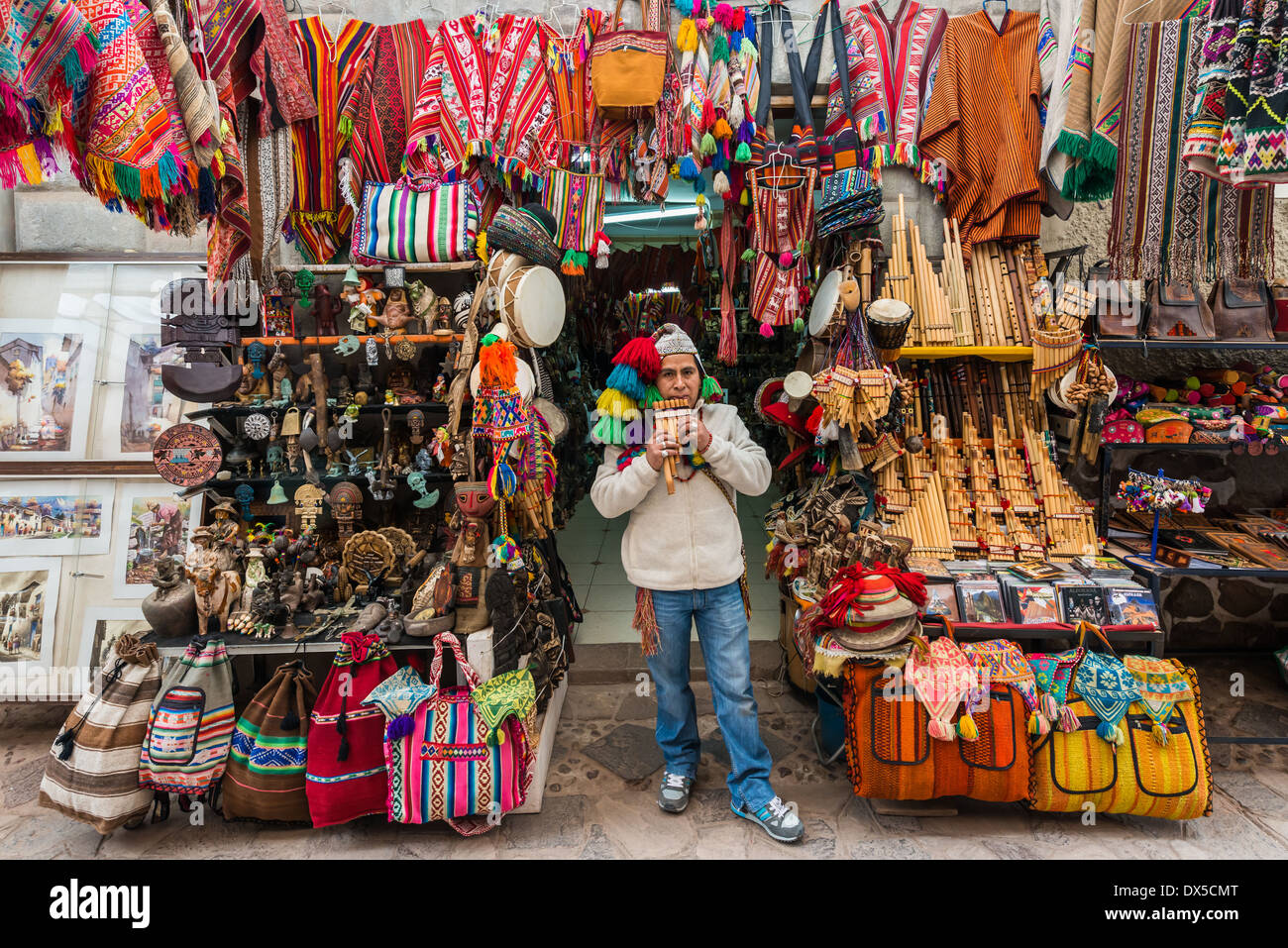 Pisac, Peru - July 14, 2013: man playing pan flute at Pisac market in the peruvian Andes at Cuzco Peru on july 14th, 2013 Stock Photo