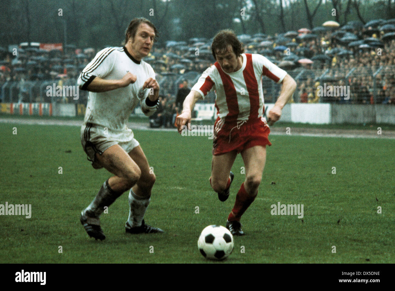 football, 2. Bundesliga Nord, 1974/1975, Lohrheide Stadium, SG Wattenscheid 09 versus Fortuna Cologne 0:0, scene of the match, Lothar Kobluhn (09) left and Peter Boers (Koeln) Stock Photo